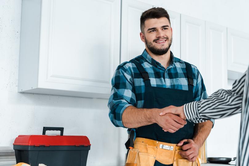  seo-agency for home service companies in Durham  - local-contractor-shaking-hands-with-woman