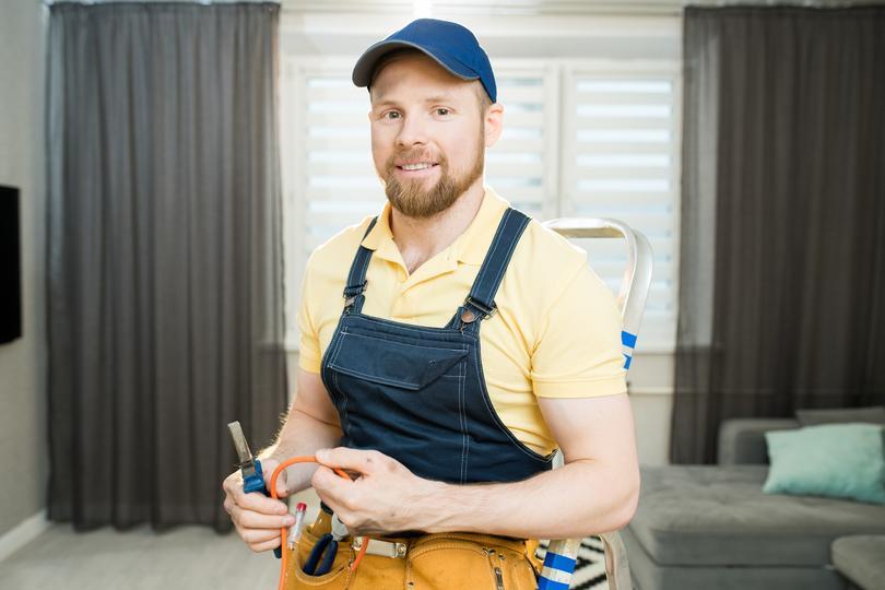  seo-agency for home service contractors in Leith  - positive-electrician-repairing-wires-in-flatJPG